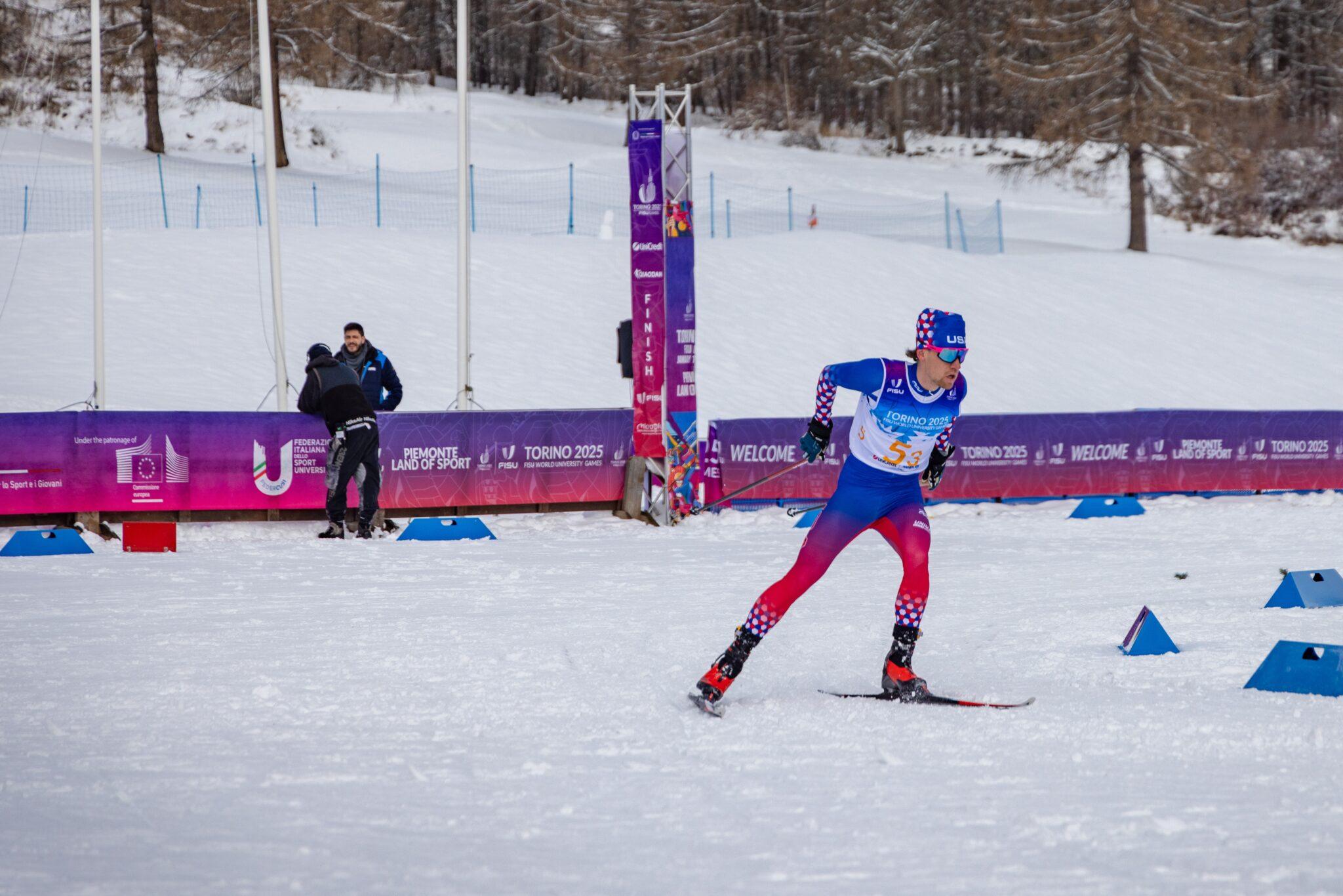 A Western Nordic athlete skiing in the FISU World Cup competition