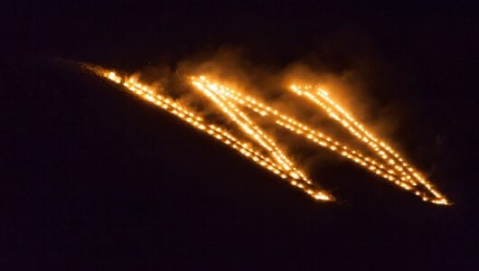 The lighting of the W on Tenderfoot Mountain during the Aspinall-Wilson Center Kickoff for Homecoming Weekend.