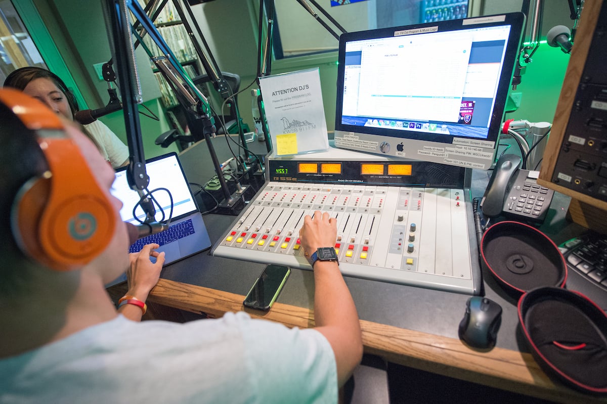 A DJ does live, on-air mixing.