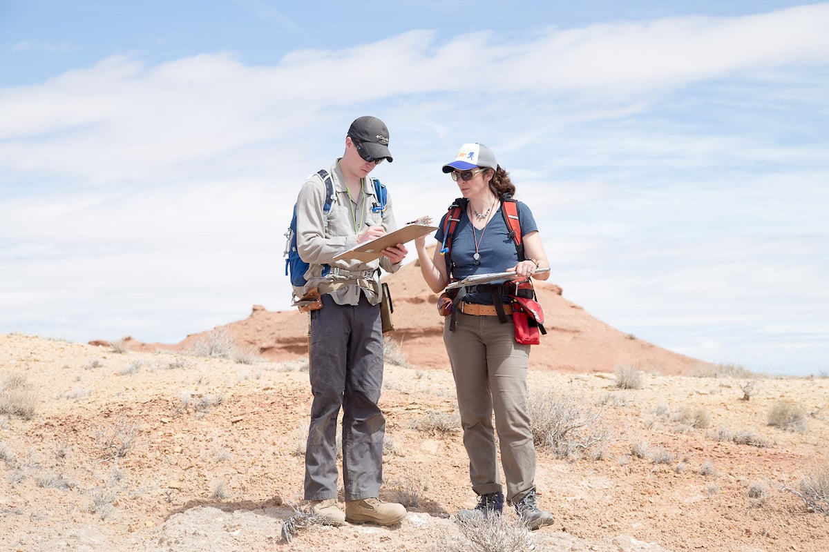 Dr. Petrie assists Kurt with his field notes.