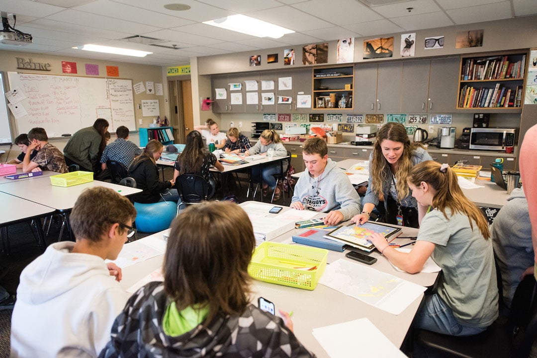 A high school classroom working on their school work.