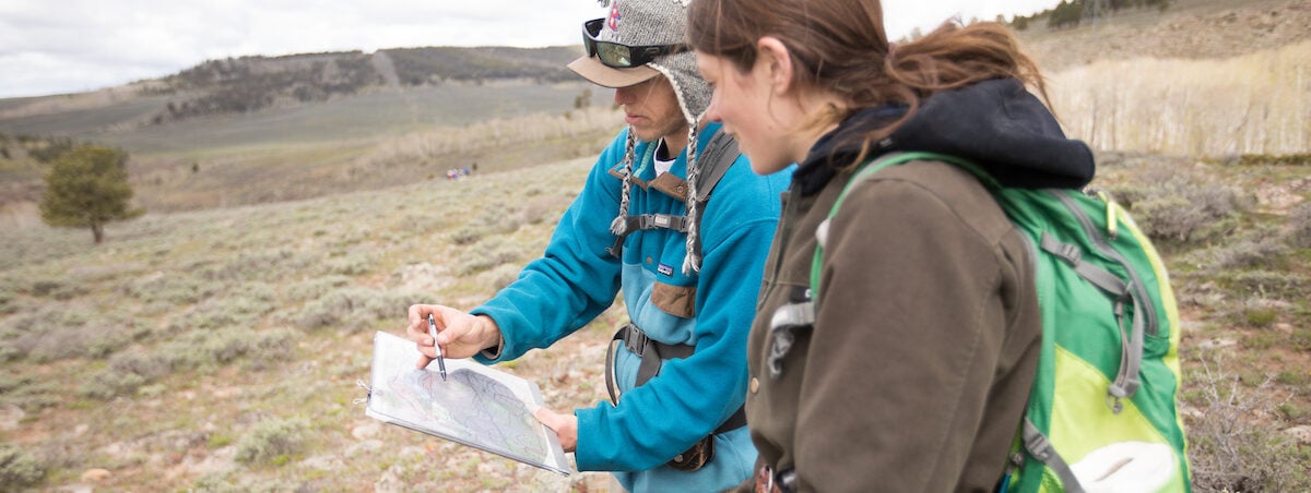 Student Maria Skarzynski collaborates with a friend during Geology Field Camp