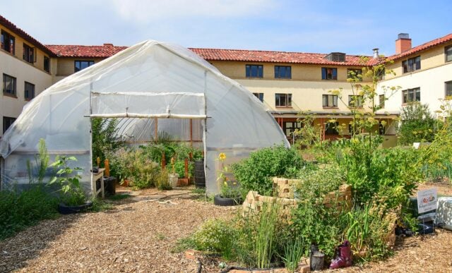 The Chipeta Garden exterior with the Chipeta Apartments seen in the background.