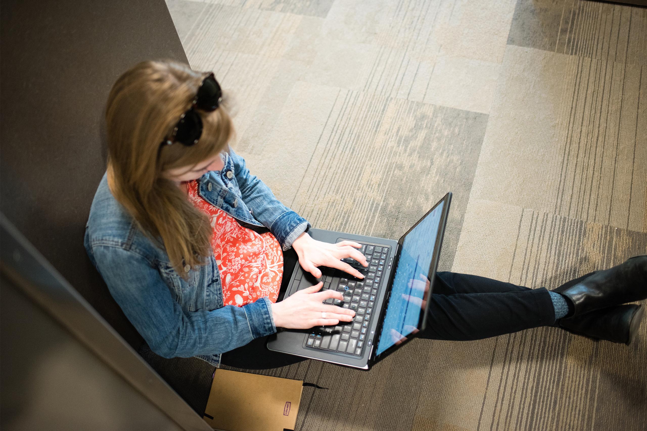 A student using a laptop