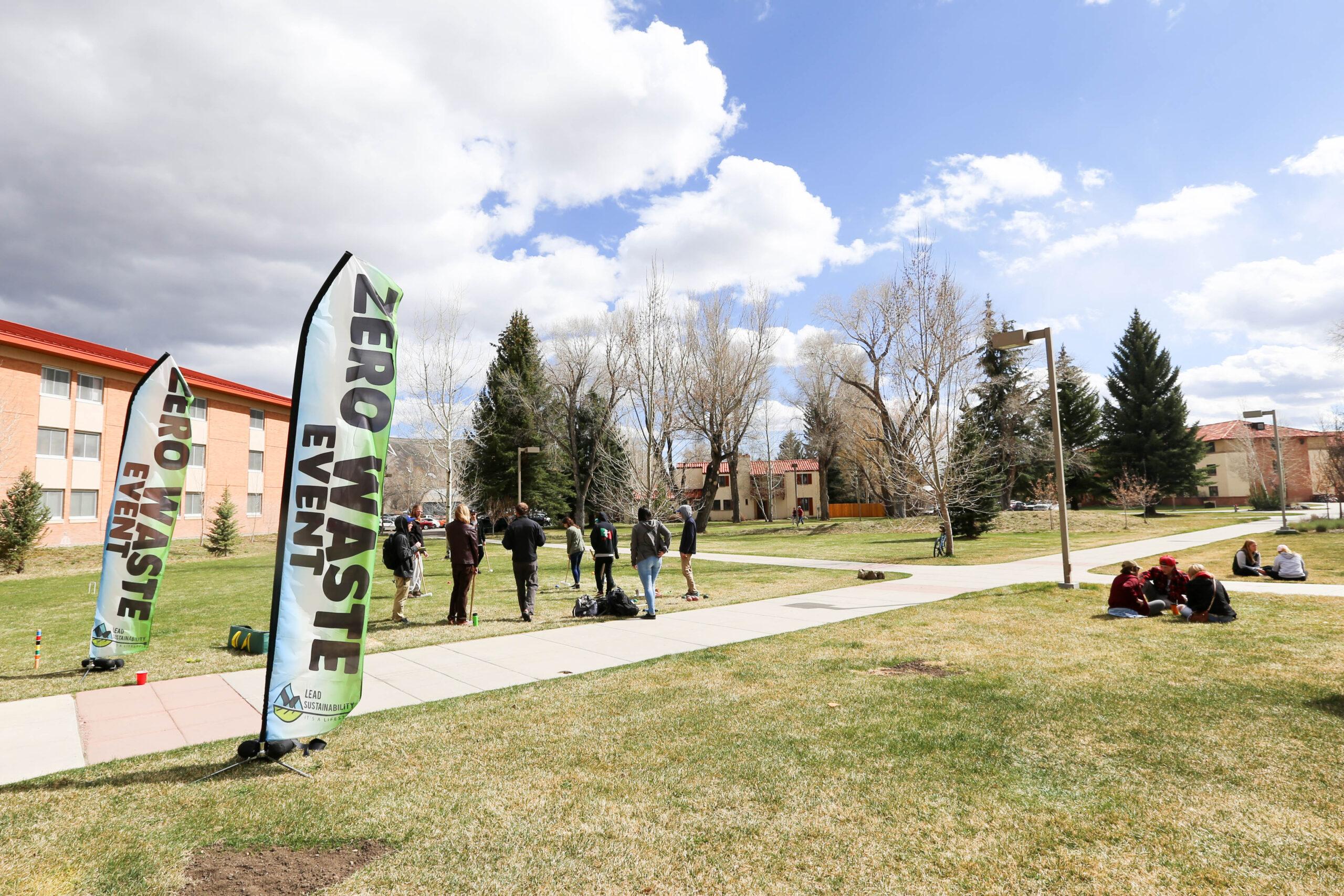 Flags displaying "Zero Waste" at an on-campus event