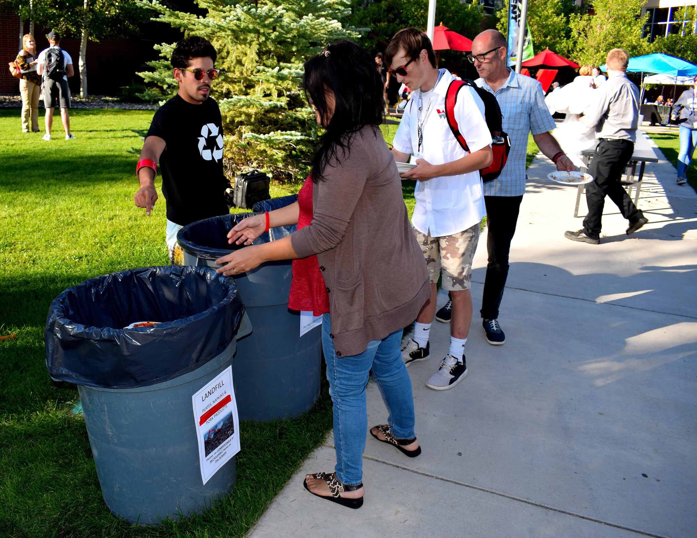 A student educates people about recycling