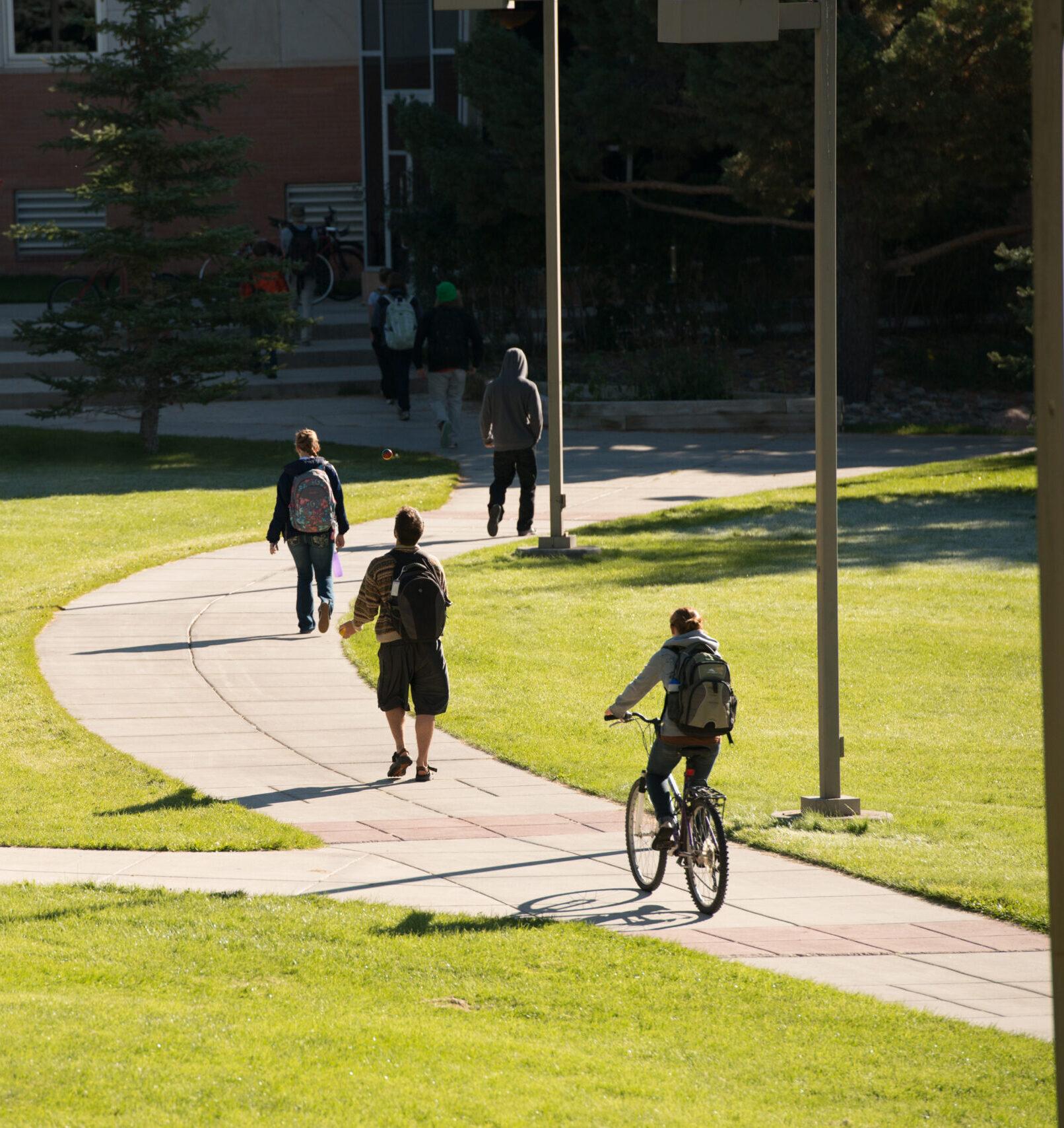 Students ride bikes on campus