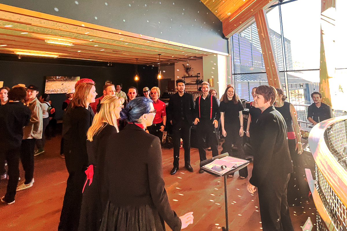 students standing in half circle performing