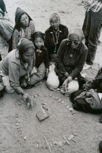 Women playing Navajo stick game 1980