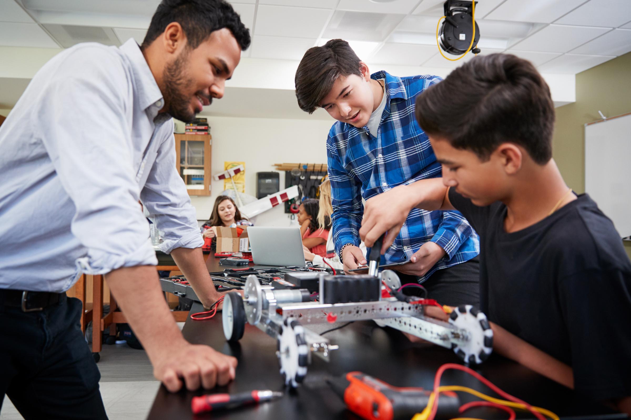 Students building robotic vehicle