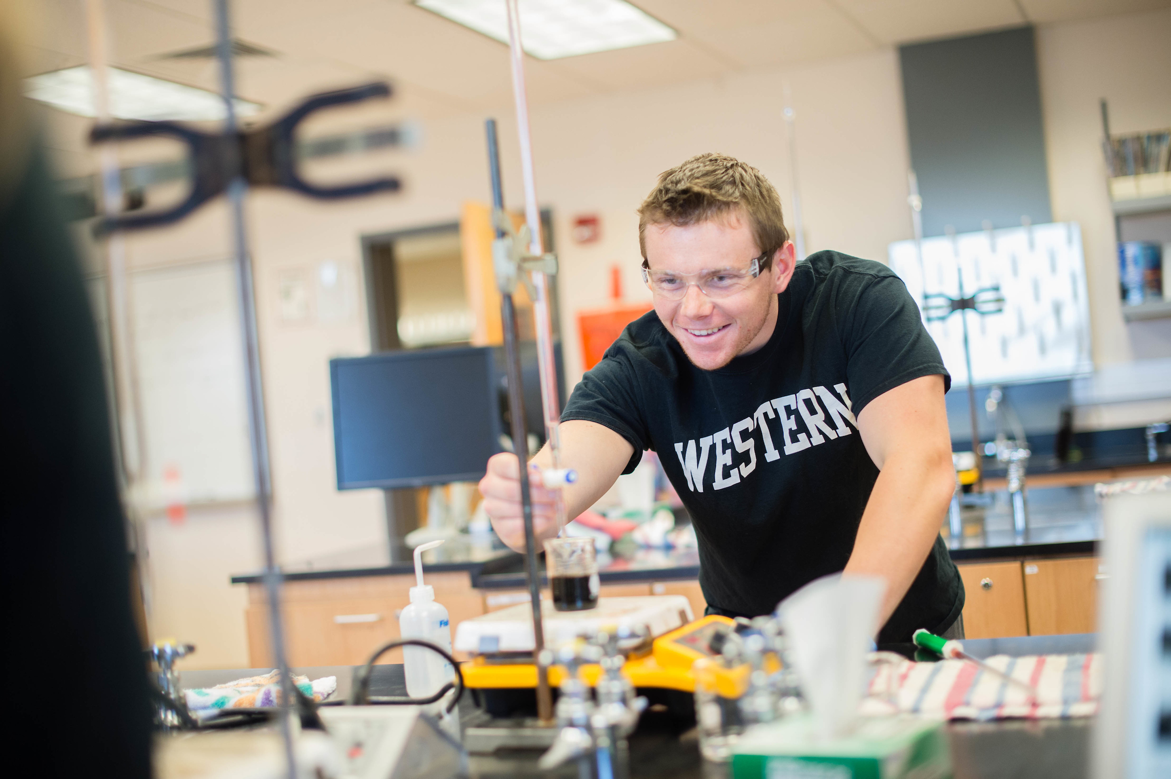 Student working in the lap on an experiment