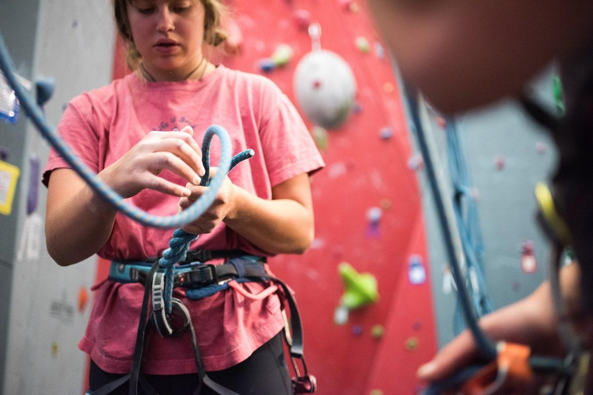 college success: student learning how to rock climb