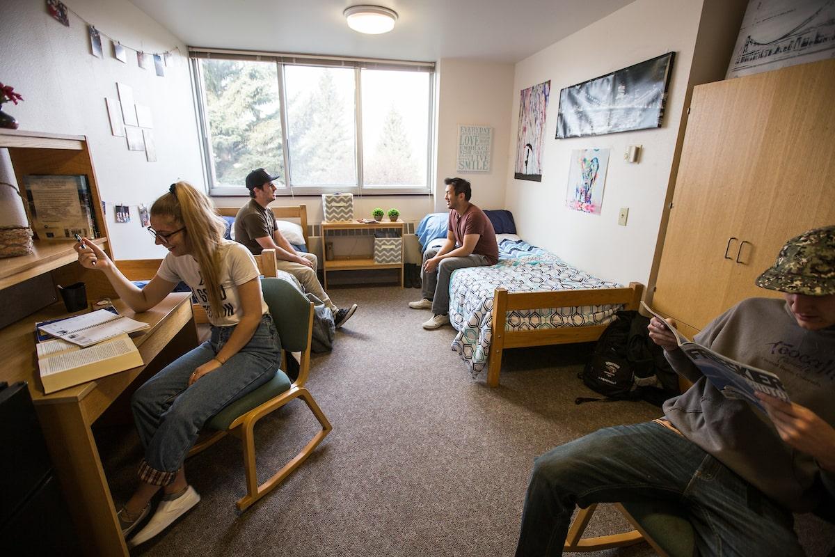 college freshman checklist: students in dorm room