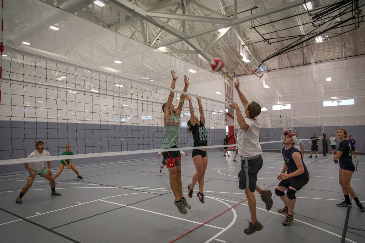 colleges with best alumni network: students playing volleyball in Western gym