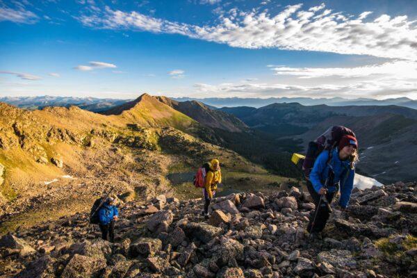 things to do in western colorado: students hiking mountain