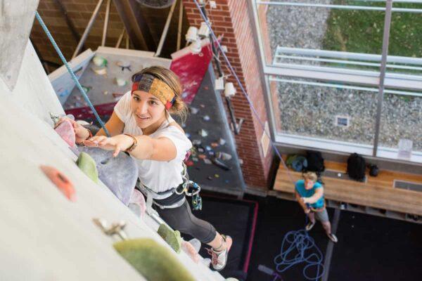 Colleges with rock climbing teams: student climbing top rope