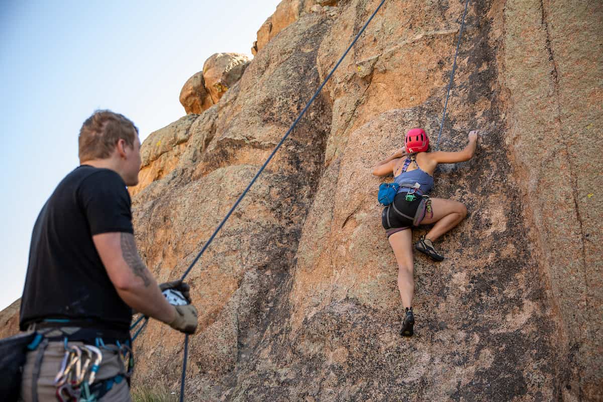 Best colleges for rock climbing: students top roping outdoors