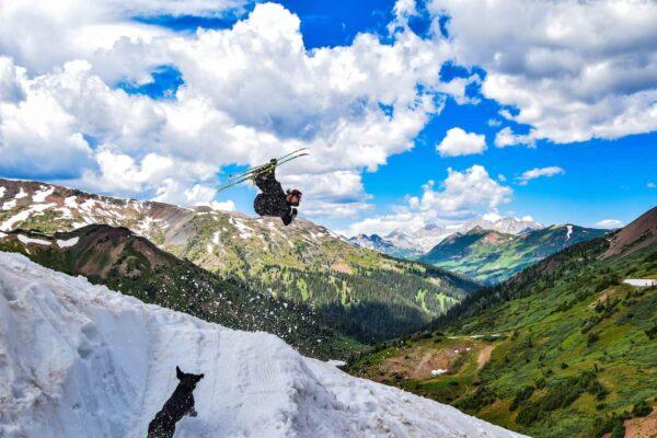 Outdoor college student jumps off ski ramp