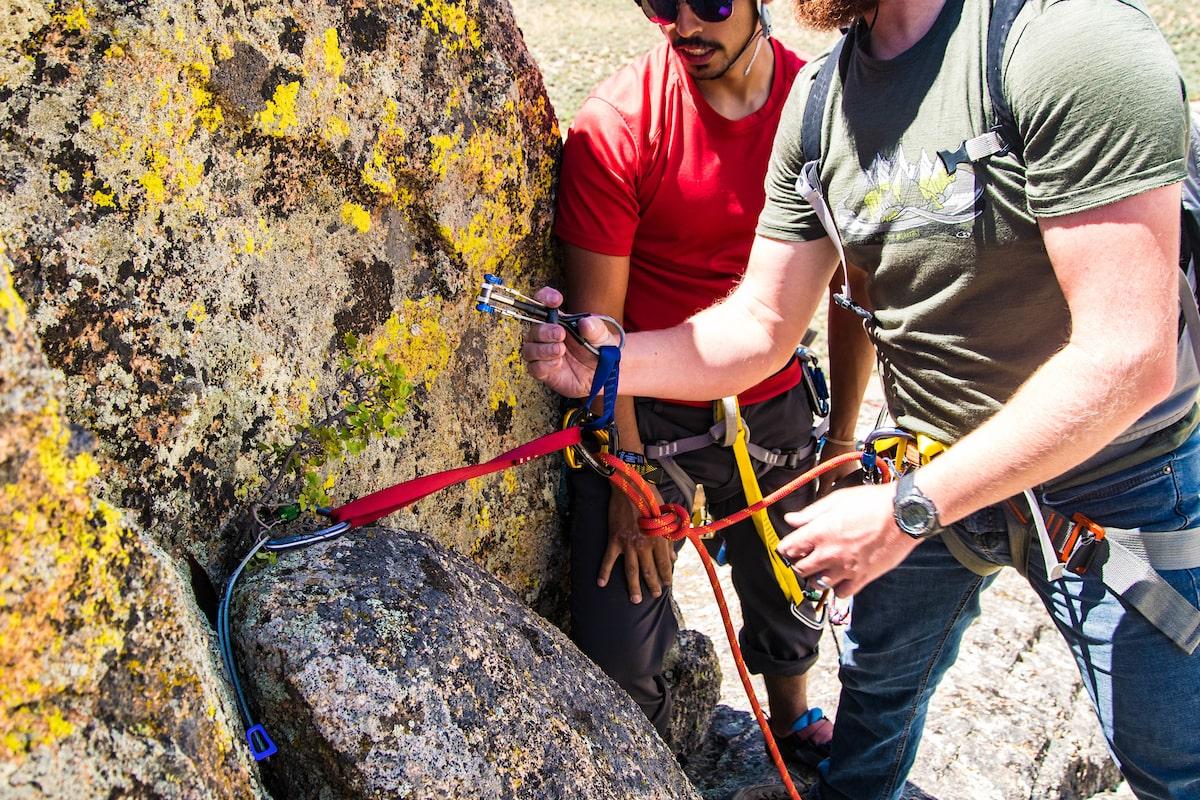 bachelor's degree in outdoor leadership: student learning how to to trad climbing