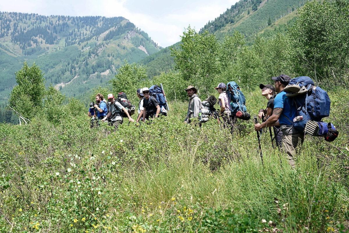 national outdoor leadership program: class on a hike in the mountains of Gunnison