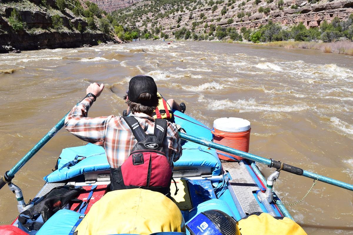 best outdoor leadership programs: student rafting down a river