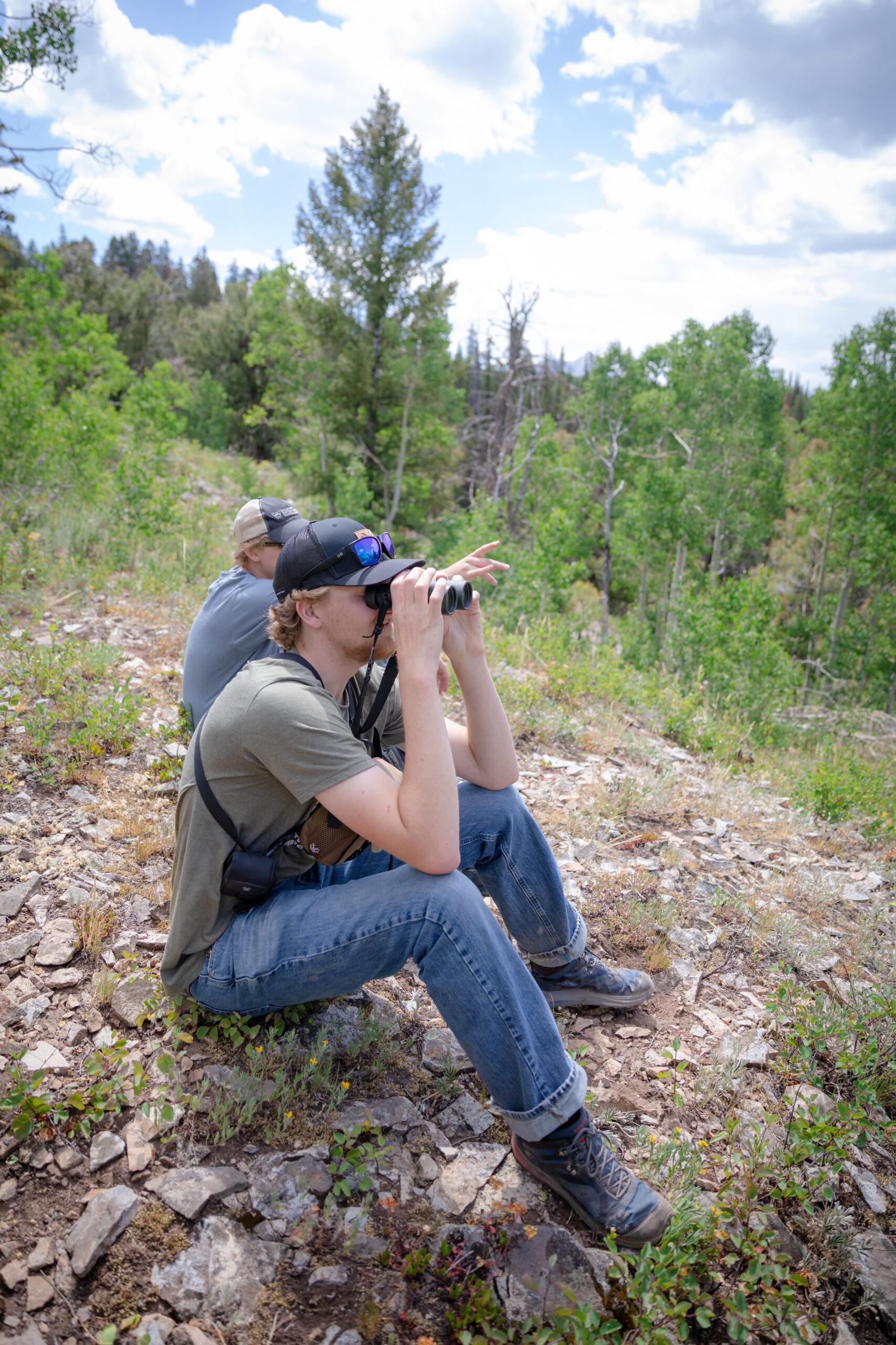 An Outdoor Industry MBA student takes in the views of Gothic with his binoculars.