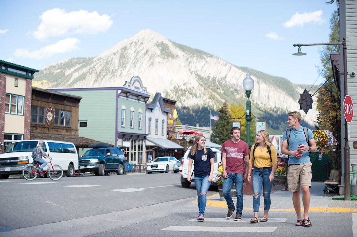 students walking through mountain town