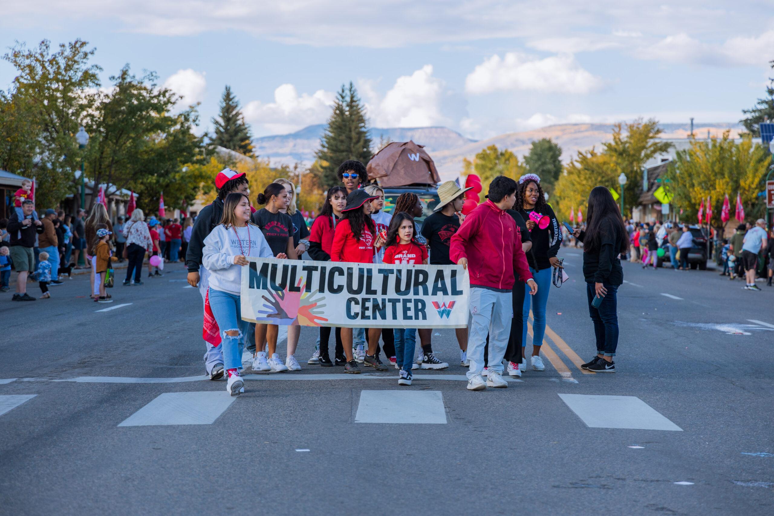 The Multicultural Center parades down Main street during the annual Homecoming Parade.