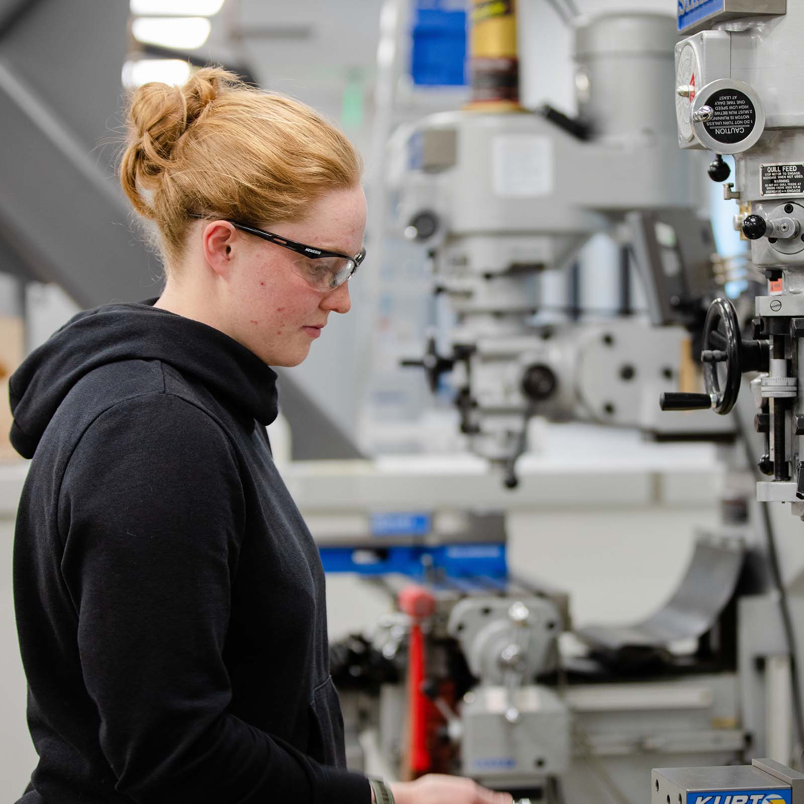 An engineering student works in a lab