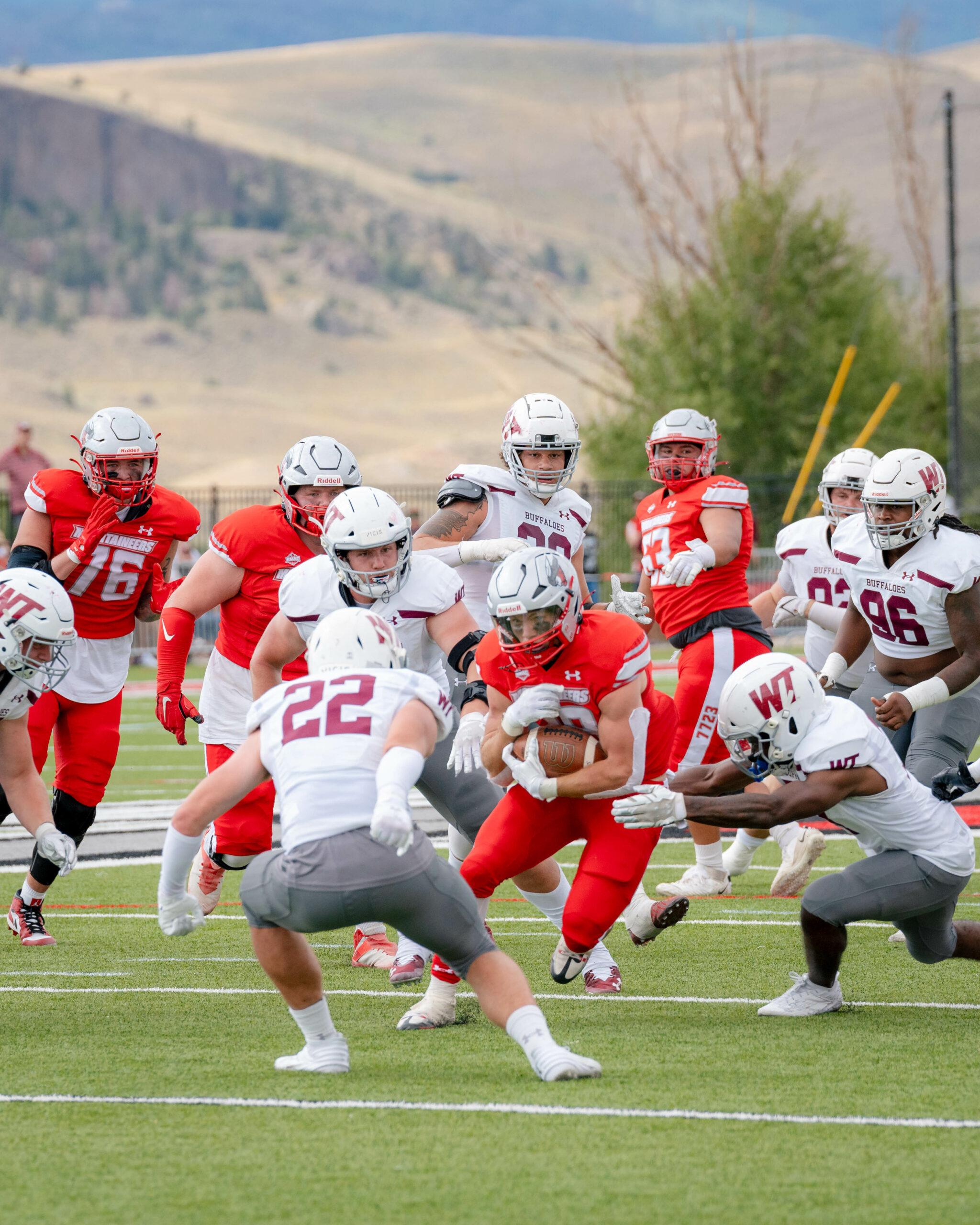 Player runs with ball through West Texas defensive line