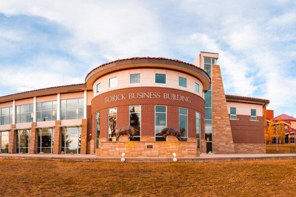 Photo of Borick Business Building on a fall evening