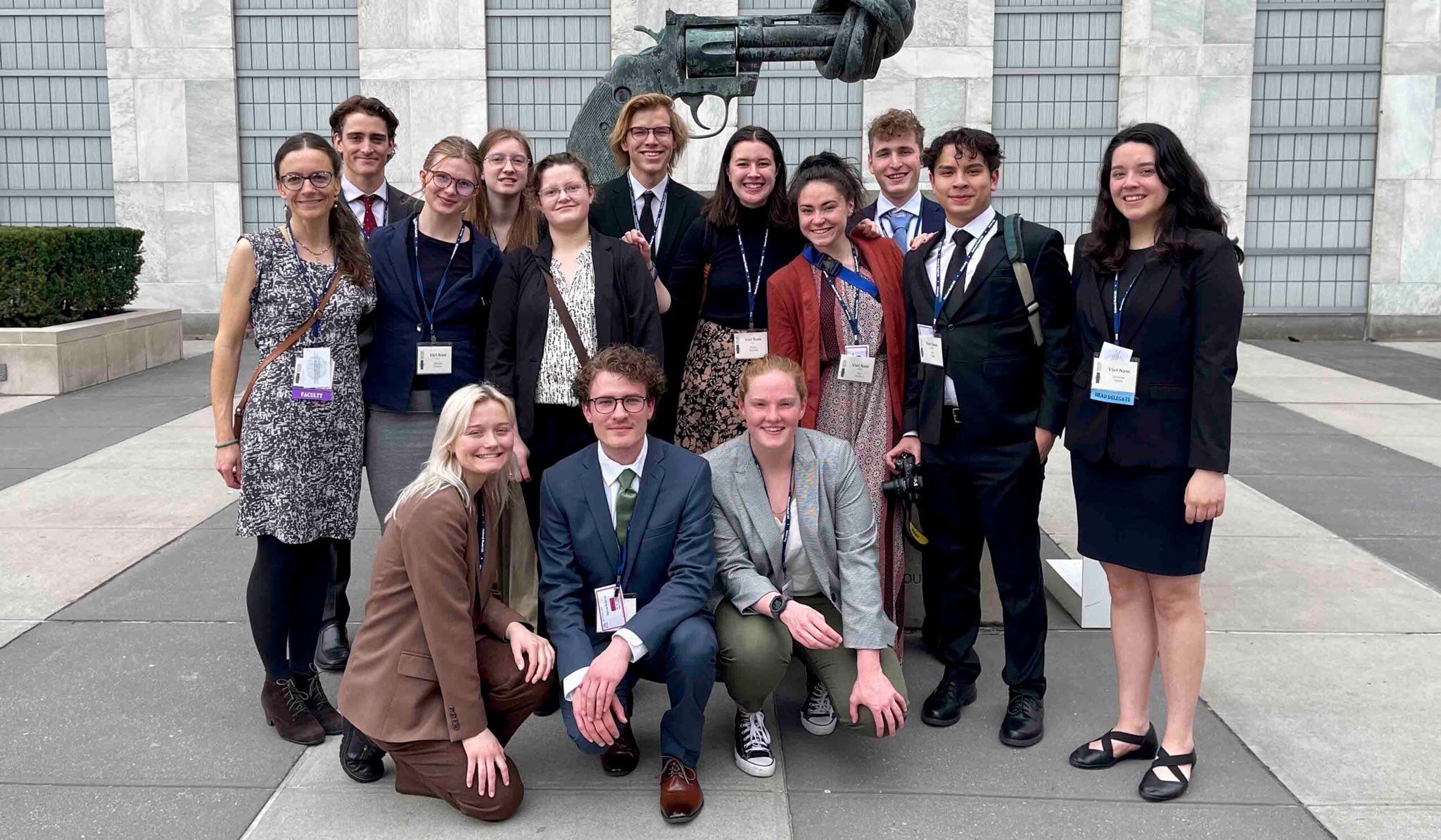 Group photo of Model UN students and professor in New York.
