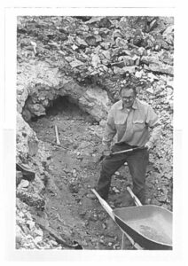 Gary Christopher uses a pickaxe outside of a mine.