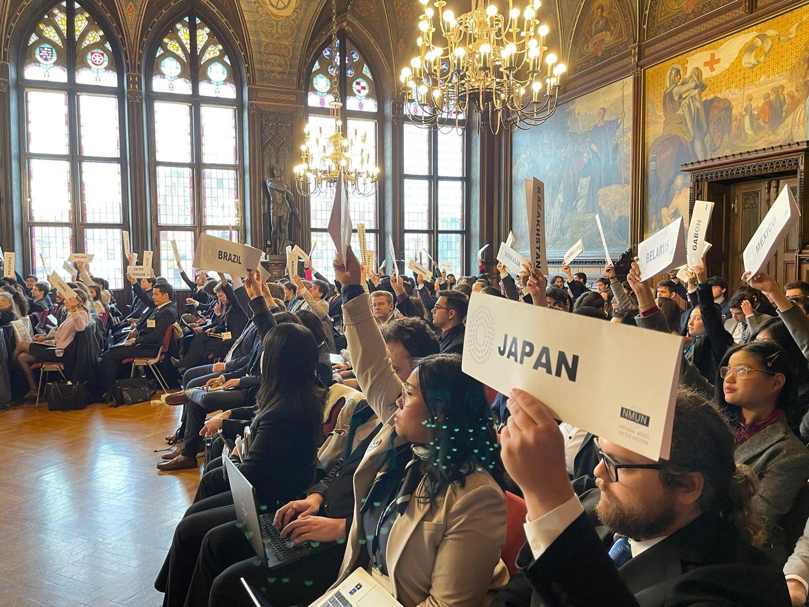 Students attending Model UN participate in a learning exercise.