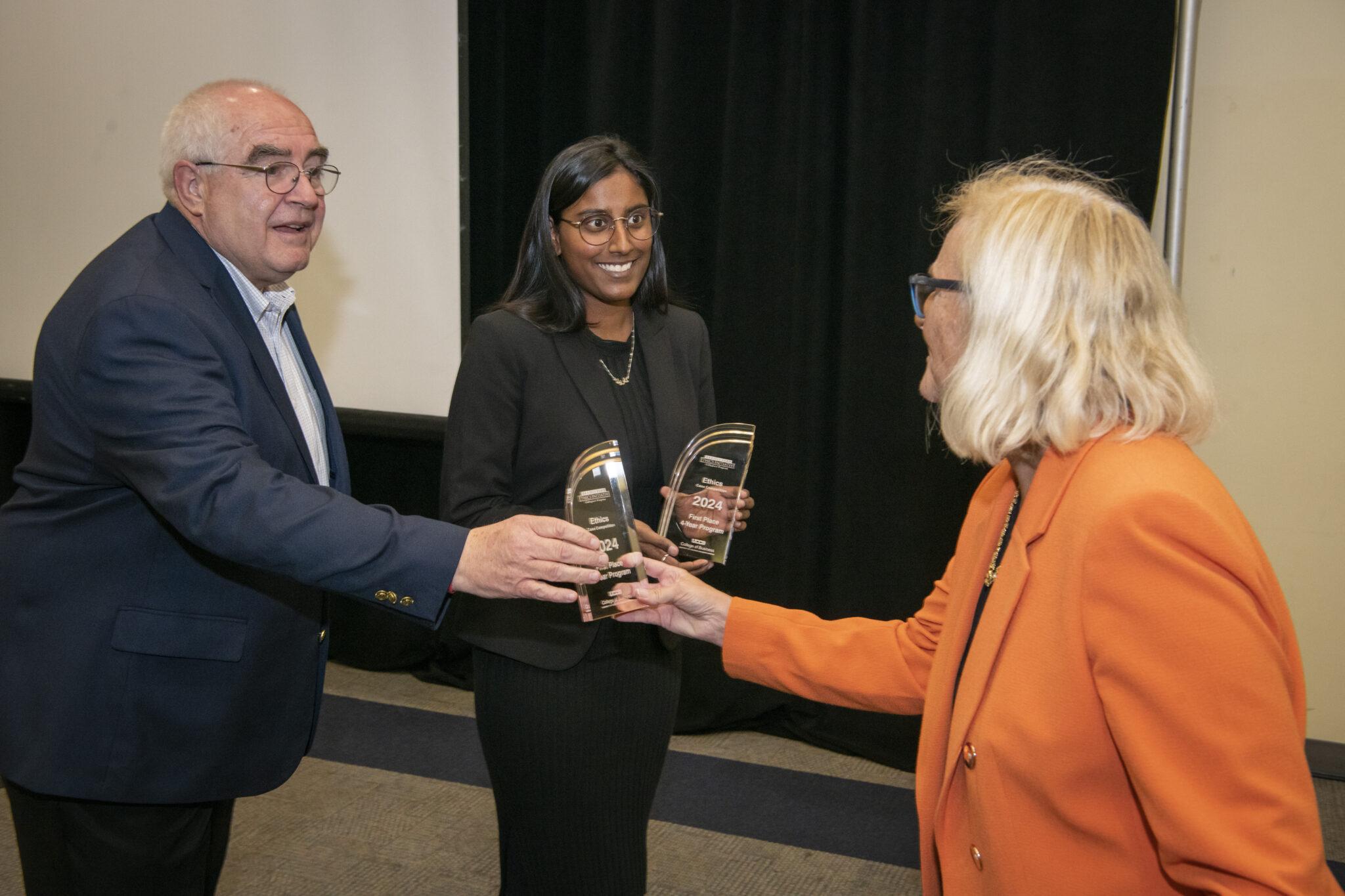 Professor Vieregge and a student accept their awards