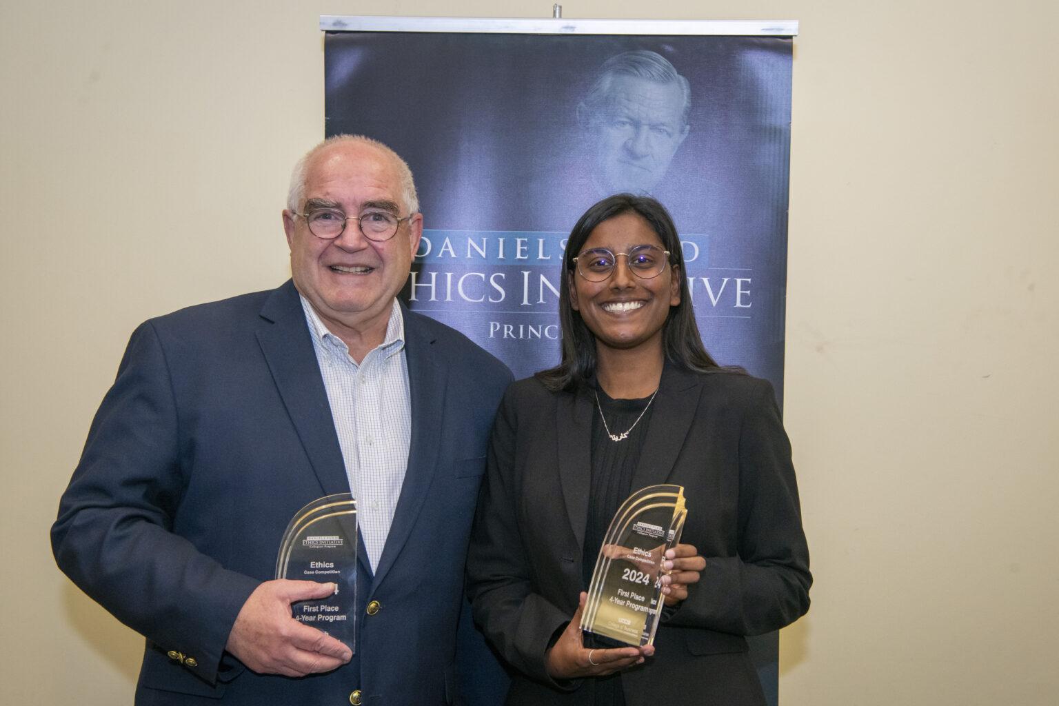 Professor Vieregge and a student pose with their awards