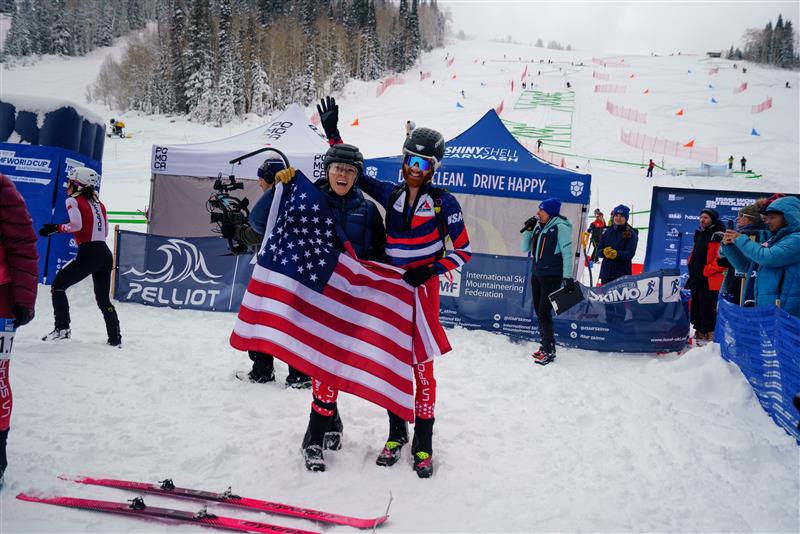 Posing with the American flag at a race.