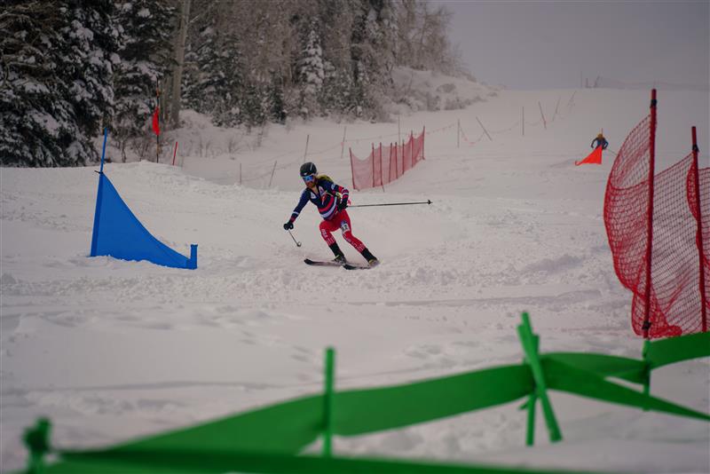 Cam Smith racing down a hill at the skimo race.
