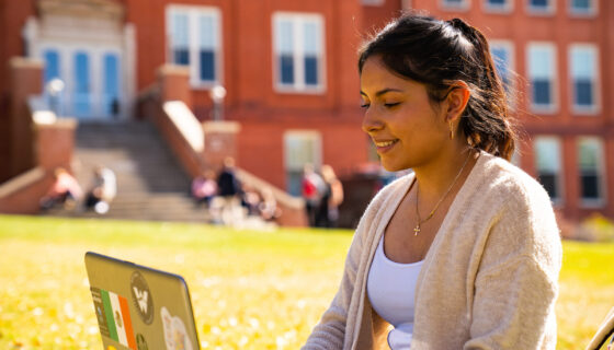 A student does homework on a laptop.