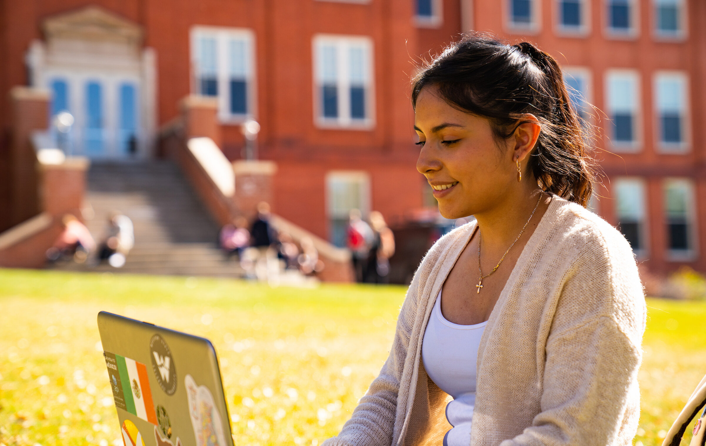 A student does homework on a laptop.