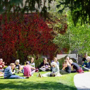 A group of students attend an outdoor class.