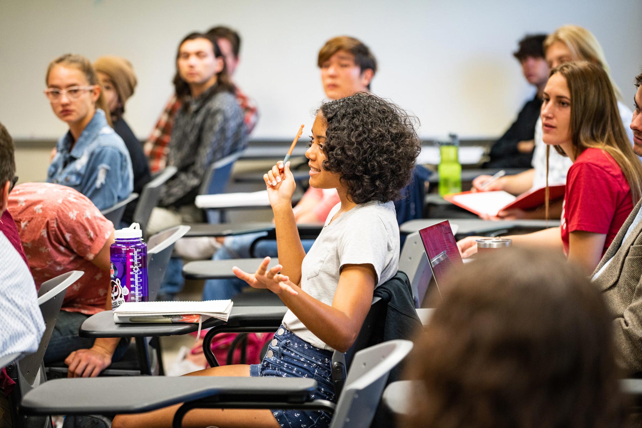 A student comments on class material during a political science class.