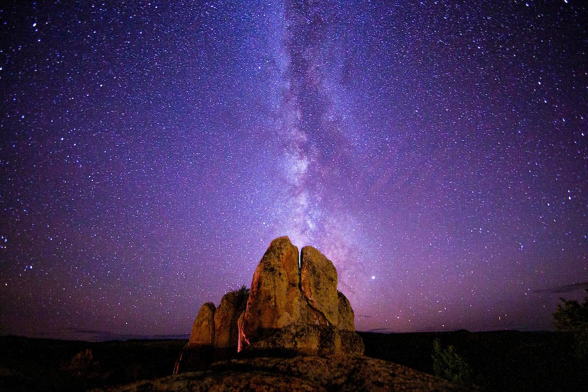 The Milky Way photographed behind a rock formation at Hartman Rocks.