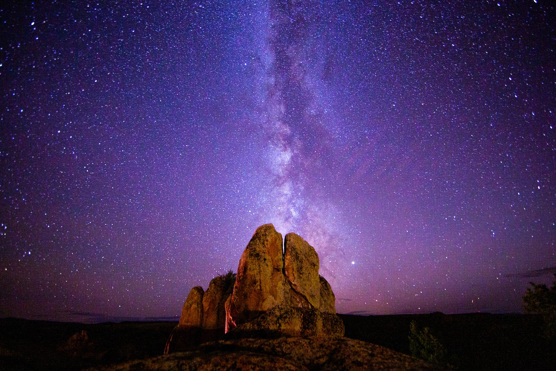 The Milky Way photographed behind a rock formation at Hartman Rocks.