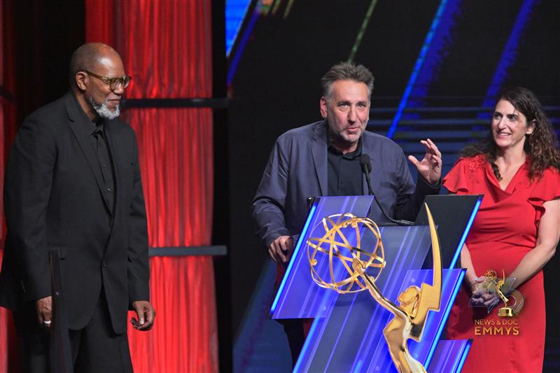 Julian Rubinstein accepts his award on stage.