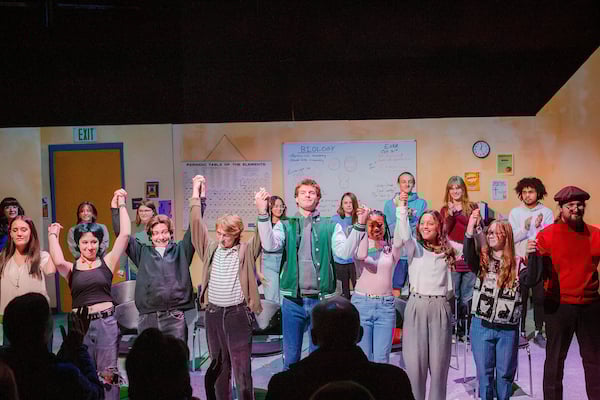 Students in Western Theatre Co Production of "Nothing is the End of the World" Bowing at the end of their show, holding hands.