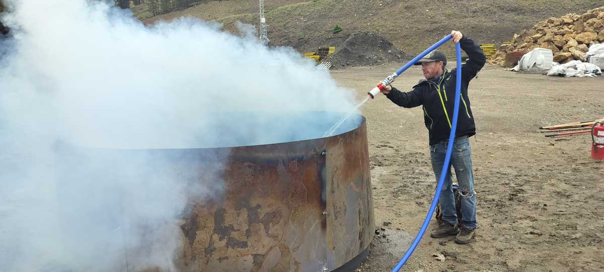 Man creates biochar.