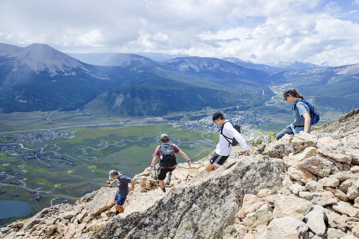 Students descend Mount Crested Butte on University Day.