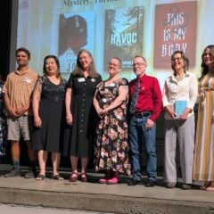 A group of writers stand on stage at the 2026 Colorado Book Awards Ceremony.