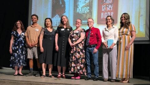 A group of writers stand on stage at the 2026 Colorado Book Awards Ceremony.